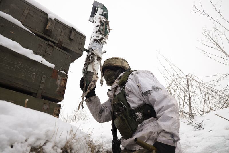A Ukrainian serviceman carries out checks not far from the pro-Russian militant-controlled city of Donetsk, Ukraine. EPA