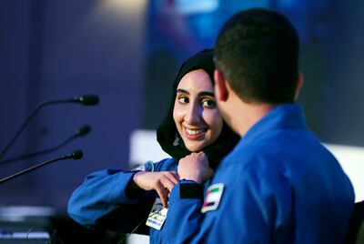 Emirati trainee astronaut Nora Al Matrooshi talks to her colleague, Mohammad Al Mulla, during their first public appearance at a news conference held by Mohammed bin Rashid Space Centre, in Dubai. AP