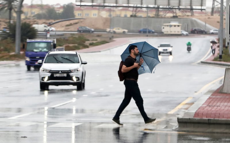 People have been reaching for their umbrellas as heavy rain falls on Dubai. Pawan Singh / The National 
