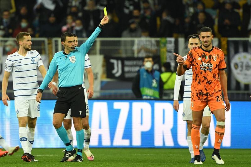 Juventus defender Merih Demiral is shown a yellow card. AFP