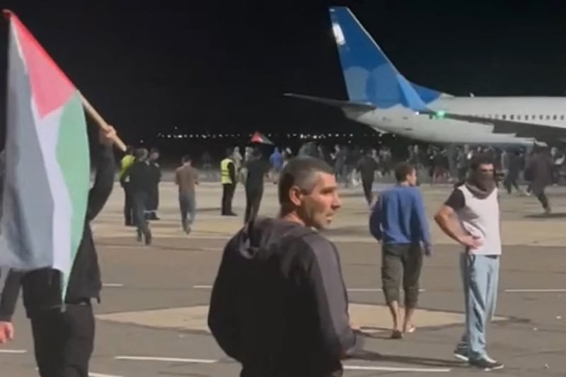Airline employees rushed passengers back inside planes as the crowds approached the aircraft