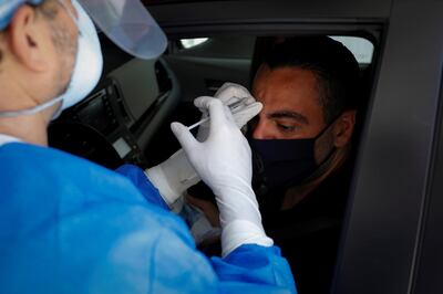 Michael Salzhauer, a plastic surgeon known as Dr. Miami, applies Botox to a patient while conducting drive-through Botox injections in the garage of his clinic, as Miami-Dade County eases some of the lockdown measures put in place during the coronavirus disease (COVID-19) outbreak, in Miami, Florida, U.S., May 31, 2020. Picture taken May 31, 2020. REUTERS/Marco Bello