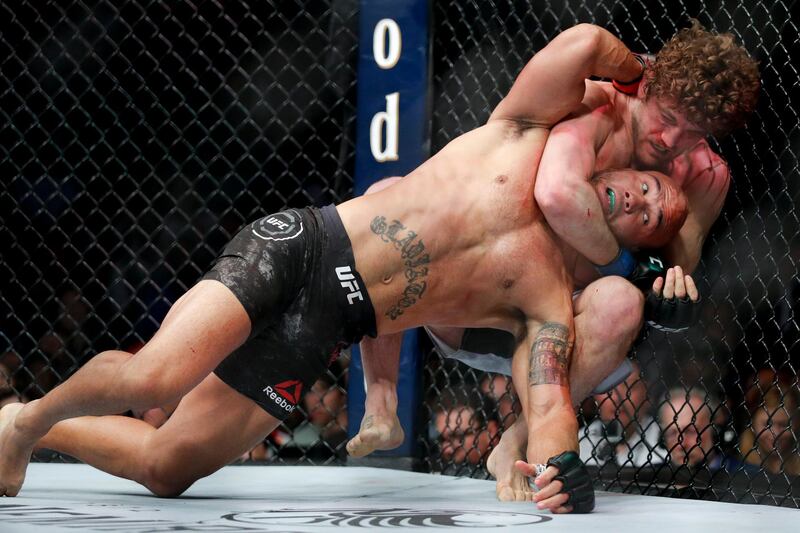 Ben Askren chokes Robbie Lawler in a welterweight mixed martial arts bout at UFC 235, Saturday, March 2, 2019, in Las Vegas. (AP Photo/John Locher)