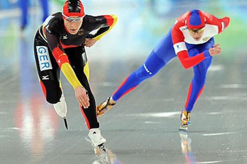 Germany's Anni Friesinger and Russia's Yekaterina Shikova during the 1,000 metre time trial run at the Olympic Oval in Vancouver yesterday.