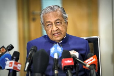 Malaysia's former prime minister Mahathir Mohamad, speaks at a press conference. Photo by Vincent Thian / POOL / AFP