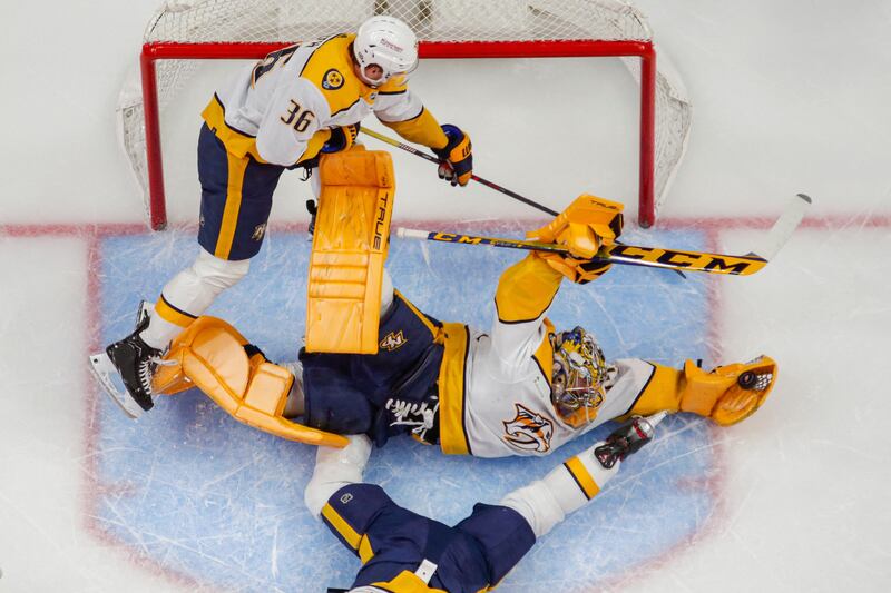 Nashville Predators goaltender Juuse Saros dives for a glove save during a game against Detroit Red Wings at Little Caesars Arena in Detroit, Michigan, US. Reuters