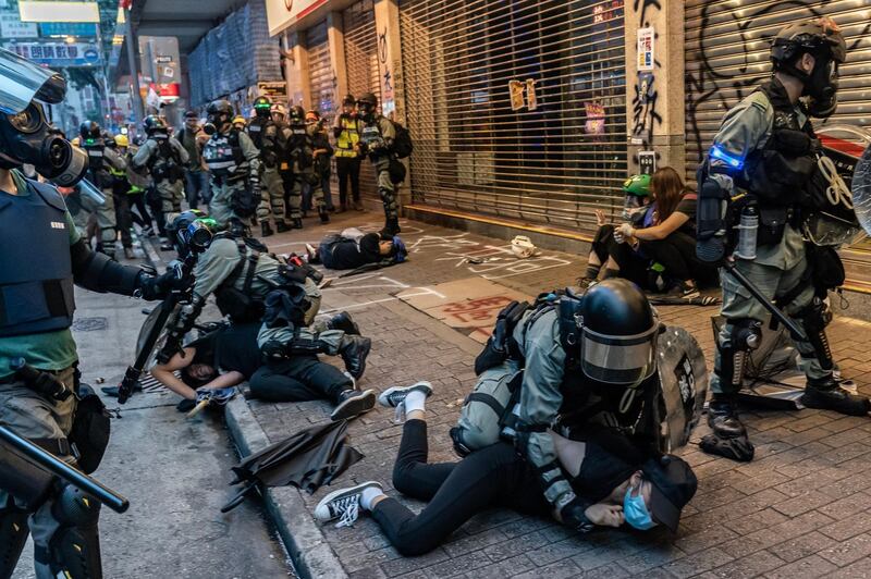 Anti-government protesters are arrested by police during a clash at a demonstration in Wan Chai district in Hong Kong. Getty Images