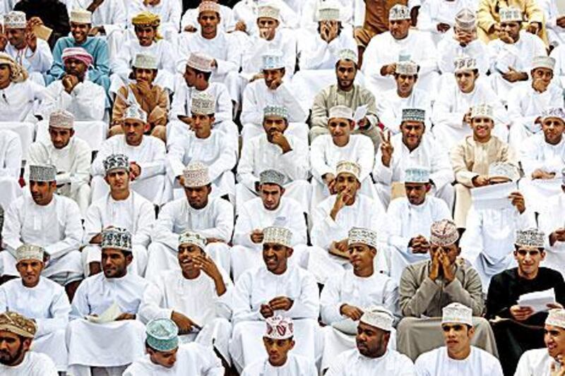 Thousands of unemployed Omanis gather at the national football stadium in Muscat in March 2011 in the hope of clinching one of the 10,000 vacancies for new police recruits.