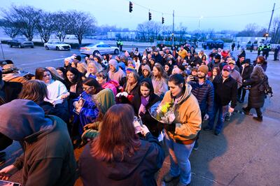 Fans line up to enter Graceland for the memorial service in the early morning hours. AP