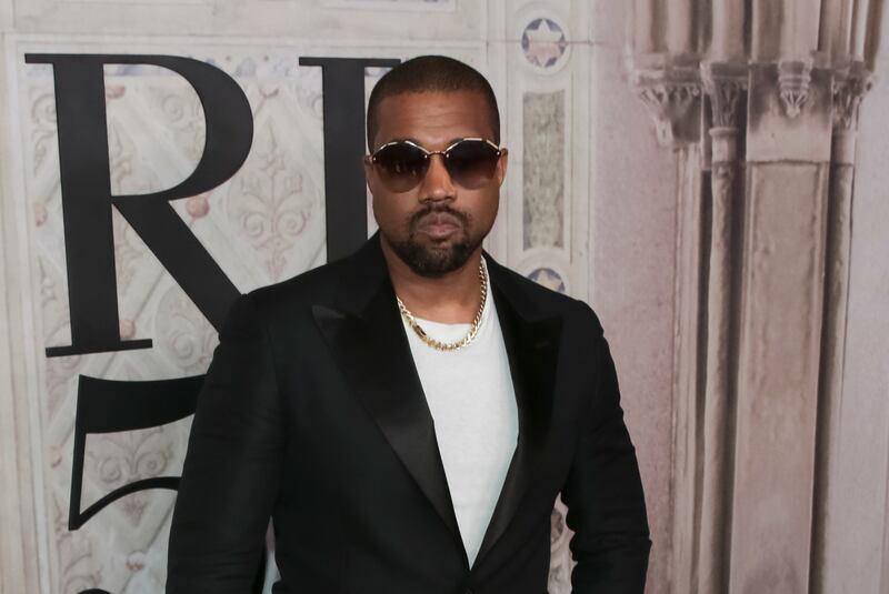 FILE - In this Sept. 7, 2018, file photo, Kanye West attends the Ralph Lauren 50th Anniversary Event held at Bethesda Terrace in Central Park during New York Fashion Week in New York. Kanye West surprised fans at a tribute honoring the late rapper XXXTentacion during Art Basel, jumping onstage to perform his brand new song with the rapper who was gunned down in Florida earlier this year on Thursday, Dec. 6, 2018. (Photo by Brent N. Clarke/Invision/AP, File)