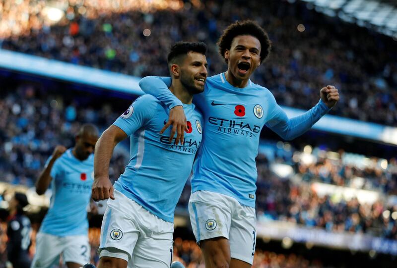 Soccer Football - Premier League - Manchester City vs Arsenal - Etihad Stadium, Manchester, Britain - November 5, 2017   Manchester City's Sergio Aguero celebrates scoring their second goal with Leroy Sane   REUTERS/Phil Noble  EDITORIAL USE ONLY. No use with unauthorized audio, video, data, fixture lists, club/league logos or "live" services. Online in-match use limited to 75 images, no video emulation. No use in betting, games or single club/league/player publications. Please contact your account representative for further details.     TPX IMAGES OF THE DAY