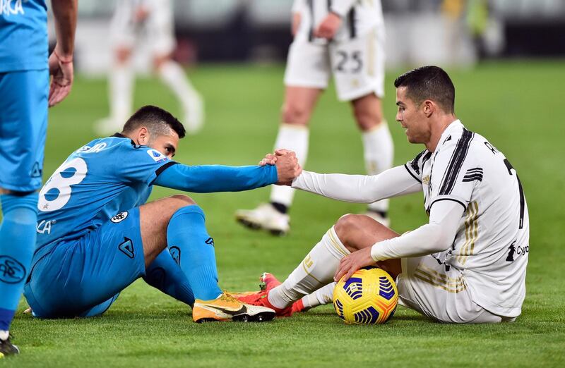 Juventus' Cristiano Ronaldo with Spezia's Leo Sena. Reuters