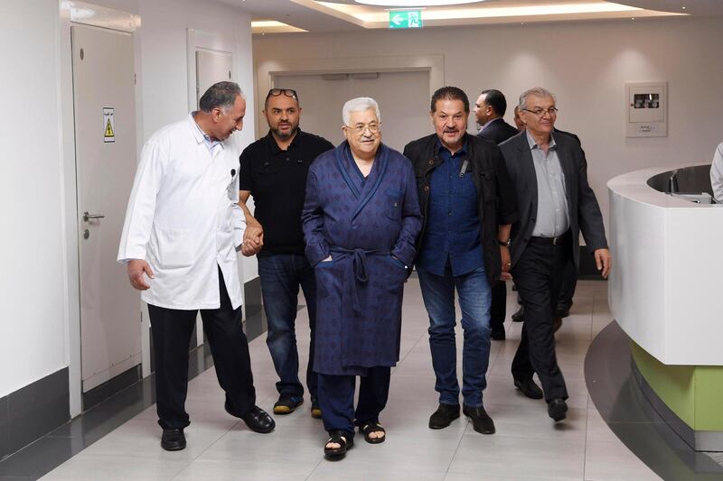 epa06754880 A handout photo made available by the Palestinian President office shows the Palestinian leader Mahmoud Abbas (C) surrounded by his sons and his doctors   talking a walk at the hospital in Ramallah, West bank,  21 May 2018. Media report that the Palestinian President Mahmoud Abbas hospitalization for the third time in the past week has led to conflicting reports about his health.  EPA/Thaer Ghanaim HANDOUT  HANDOUT EDITORIAL USE ONLY/NO SALES