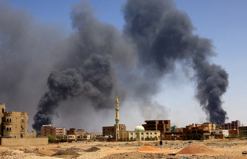 Smoke rises above buildings after an aerial bombardment during clashes between the RSF and the army in Khartoum. Reuters