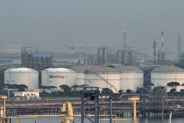 Oil storage tanks on Jurong island off Singapore. The city-state's biggest oil trader is seeking a moratorium on $3.85bn worth of debt. AFP