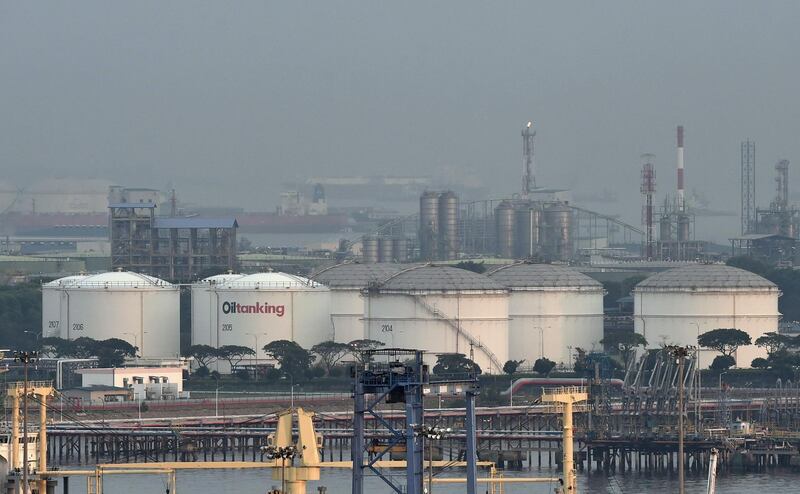 (FILES) This file photo taken on April 20, 2016 shows oil storage tanks on Jurong island off Singapore. Global oil demand will fall by a record amount this year as lockdown measures imposed to curb the coronavirus outbreak bring the economy to a virtual halt, the International Energy Agency (IEA) said on April 15, 2020.
 - 
 / AFP / ROSLAN RAHMAN
