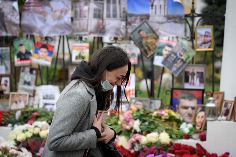 A woman cries at a makeshift memorial for Armenians killed during the military conflict with Azerbaijan over the breakaway region of Nagorno-Karabakh, outside the Armenian embassy in Moscow.  AFP