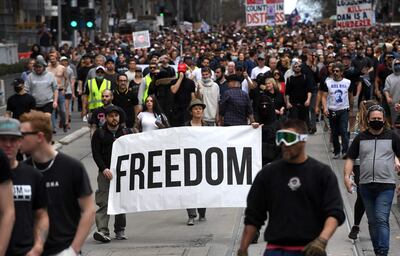 Protesters march through the streets during an anti-lockdown rally in Melbourne. AFP