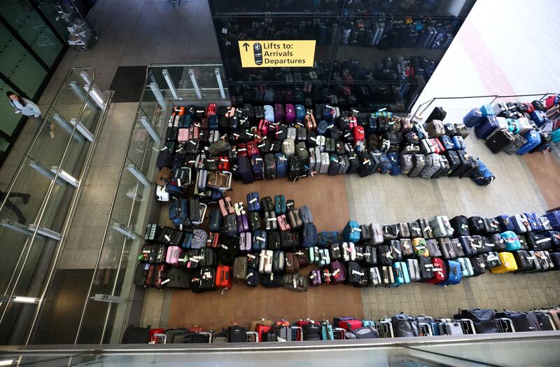 Baggage piles up outside Terminal 2 at Heathrow in June. Baggage issues have bedevilled the airport, with a combination of staff shortages and malfunctioning automated baggage handling systems contributing to the mayhem. Reuters