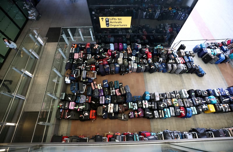 Lines of passenger luggage lie arranged outside Terminal 2 at Heathrow Airport. Reuters