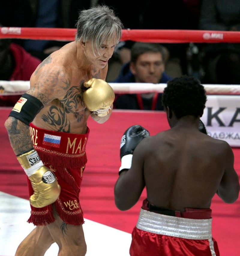 Hollywood actor Mickey Rourke, left, 62, fights with US professional Elliot Seymour, 29, in Moscow, as Rourke revives his boxing career at the age of 62 taking to the ring. Alexander Nemenov / AFP photo