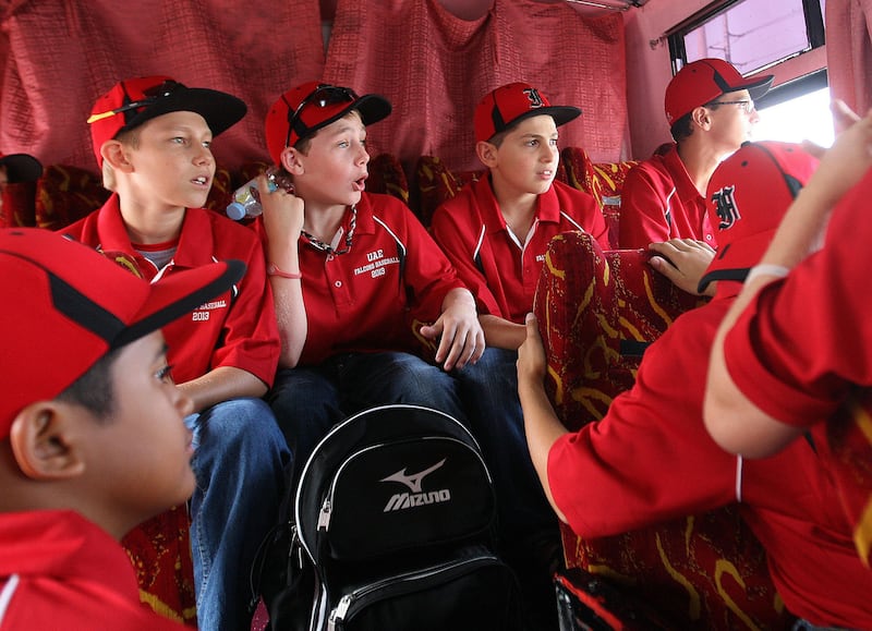 Manila Philippines, June 28 2013, Little League Asia Pacific Playoffs 2013, Sports Reporter Paul Raddley Stories- UAE Little League All-Star (left to right)  bootom left  Helmi Yatim , Sam Page , Hayden Davidson, Tony Sakrand  Zane Horger enjoy the sight of Manila on the bus as it makes its way through traffic in Manila Philippines.  UAE Little league All-Stars arrival in the Philippines June 28 2013. The team will start their playoffs competition July 1 2013 when they match up with Hong Kong in the Little League Asia Pacific Playoffs 2013. Mike Young / For The National