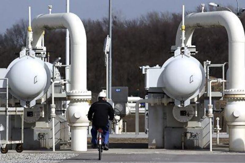 A worker rides a bicycle past gas pipes at Gas Connect Austria's gas distribution node in Baumgarten. Nabucco West, the OMV-led consortium that was bidding to build a pipeline to bring Azeri gas to Europe, has not been selected by the gas field's operators Heinz-Peter Bader / Reuters