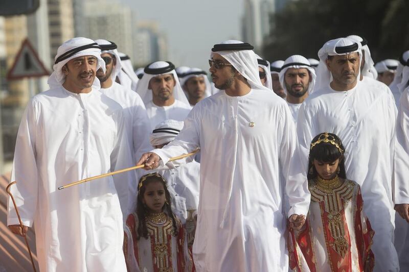 Sheikh Mansour bin Zayed, Deputy Prime Minister and Minister of Presidential Affairs speaks with Sheikh Abdullah bin Zayed, during the national parade from Al Manhal Palace to Qasr Al Hosn fort. Christopher Pike / Crown Prince Court - Abu Dhabi 