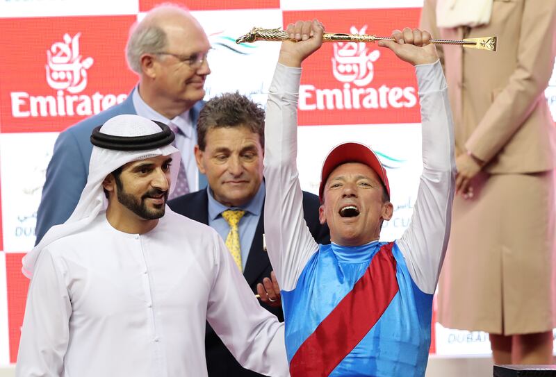 Sheikh Hamdan bin Mohammed Al Maktoum with Country Grammer jockey Frankie Dettori. Chris Whiteoak / The National