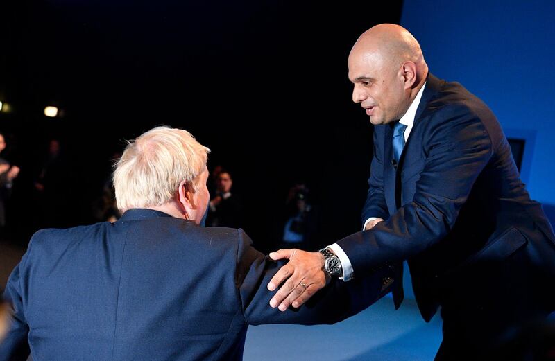 epa09304118 (FILE) - Britain's then Chancellor of the Exchequer Sajid Javid (R) is thanked by Prime Minister Boris Johnson (L) after he delivers a speech at the Conservative Party Conference in Manchester, Britain, 30 September 2019 (reissued 26 June 2021). Downing Street on 26 June 2021 said Sajid Javid was appointed to succeed Matt Hancock who resigned as Health Secretary.  EPA/NEIL HALL *** Local Caption *** 55509051