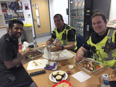 Police Constable Irfan Ishaq shares brekas his fast with colleagues in the Hertfordshire Police. 