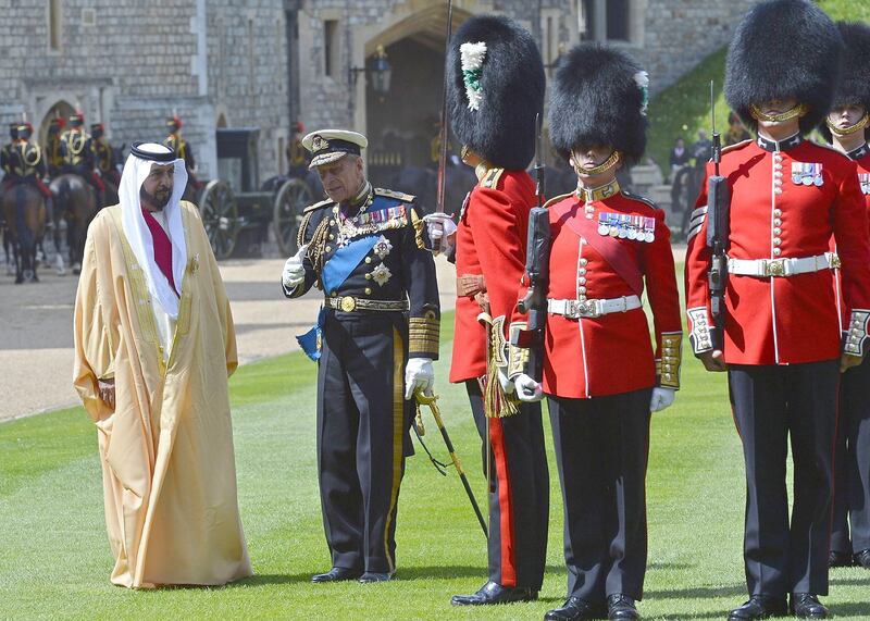 Britain's Prince Philip (2nd L) speaks with President of the United Arab Emirates Sheikh Khalifa bin Zayed al-Nahayan (L) as they prepare to review an honour guard during a Ceremonial Welcome in the town of Windsor, west of London, on April 30, 2013. The President began a two day State Visit to Britain Tuesday when he is also expected to meet with British Prime Minister David Cameron.  AFP PHOTO / TOBY MELVILLE/POOL
 *** Local Caption ***  019824-01-08.jpg