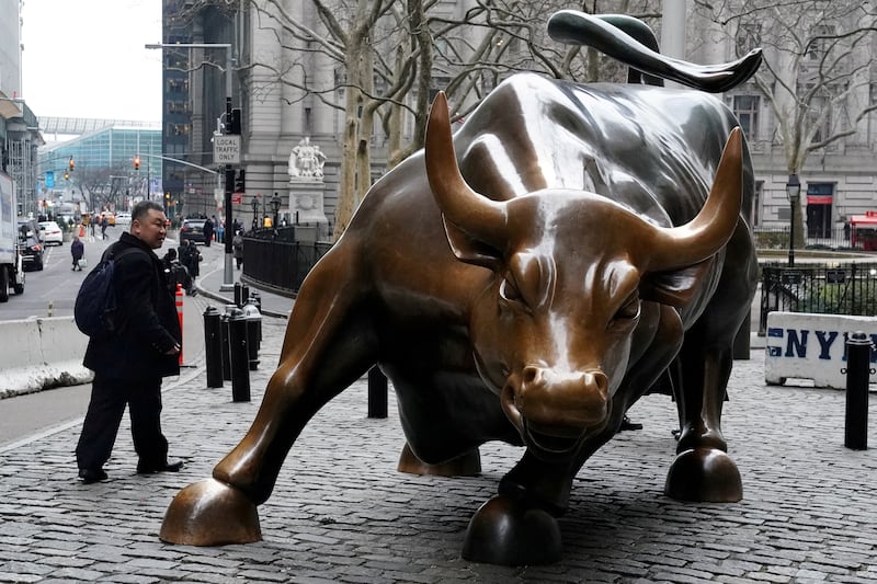 The Wall Street bull in the Manhattan borough of New York City. Analysts foresee the global economy to slow further in 2024. Reuters