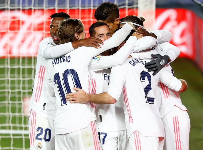 Real Madrid's Dani Carvajal celebrates with teammates after Atletico Madrid's Jan Oblak scored an own goal. Reuters