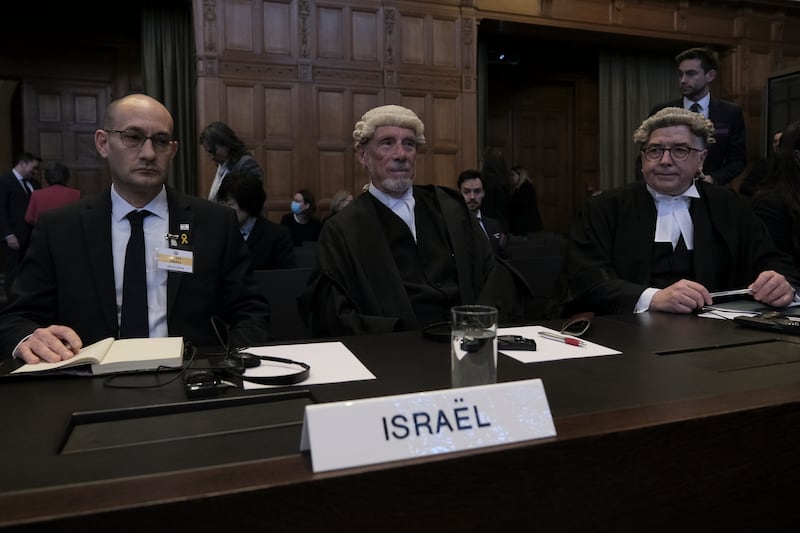British jurist Malcolm Shaw, centre, and Gilad Noam, left, Israel's Deputy Attorney General for International Affairs, attend the session. AP