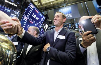 epa07561221 Ryan Graves (C), one of the co-founders of Uber, celebrates today's initial public offering for Uber at the New York Stock Exchange in New York, New York, USA, 10 May 2019. Shares of the stock in the company are being listed at $45 per share which will reportedly raise the company at least $8.1 billion / ?7.2 billion.  EPA-EFE/JUSTIN LANE *** Local Caption *** 55182738