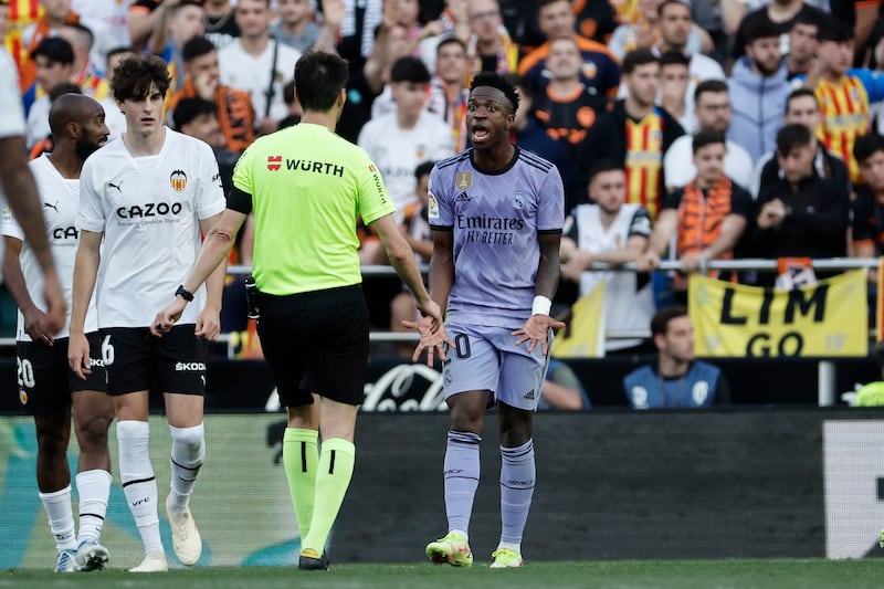 Referee Ricardo de Burgos Bengoetxea talks with Real Madrid's striker Vinicius Junior. EPA