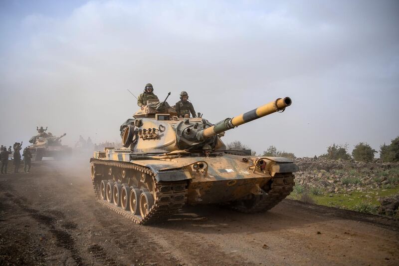 FILE - In this Monday, Jan. 22, 2018 file photo, Turkish army tanks head for Afrin, an enclave in northern Syria controlled by U.S.-allied Kurdish fighters, in Hassa, Hatay, Turkey. Turkeyâ€™s military offensive on the Syrian border town of Afrin, controlled by Kurdish fighters, has been long in coming. Turkish officials have been threatening to launch the offensive and preparing for it for months. But there have been shades of gray in Ankaraâ€™s professed goals about the military incursion, which was launched on Saturday. (AP Photo, File)