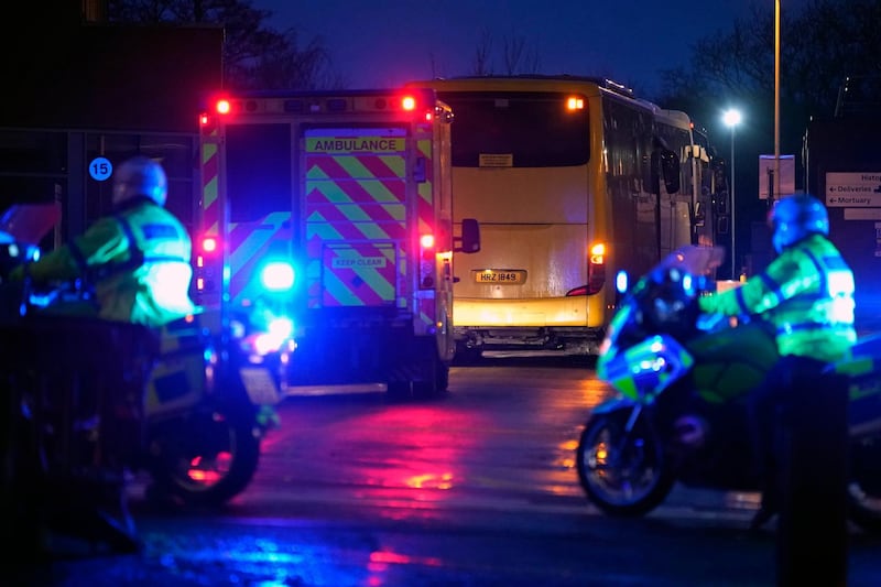 WIRRAL, MERSEYSIDE - FEBRUARY 22: An ambulance and police are seen as coaches containing British Diamond Princess evacuees arrive at Arrowe Park Hospital on February 22, 2020 in Wirral, United Kingdom. UK nationals who have spent 16 days in quarantine on the coronavirus-hit Diamond Princess cruise liner have been repatriated after testing negative for the virus. After landing in the UK, the group will spend 14 days quarantined at Arrowe Park Hospital in the Wirral. (Photo by Christopher Furlong/Getty Images)