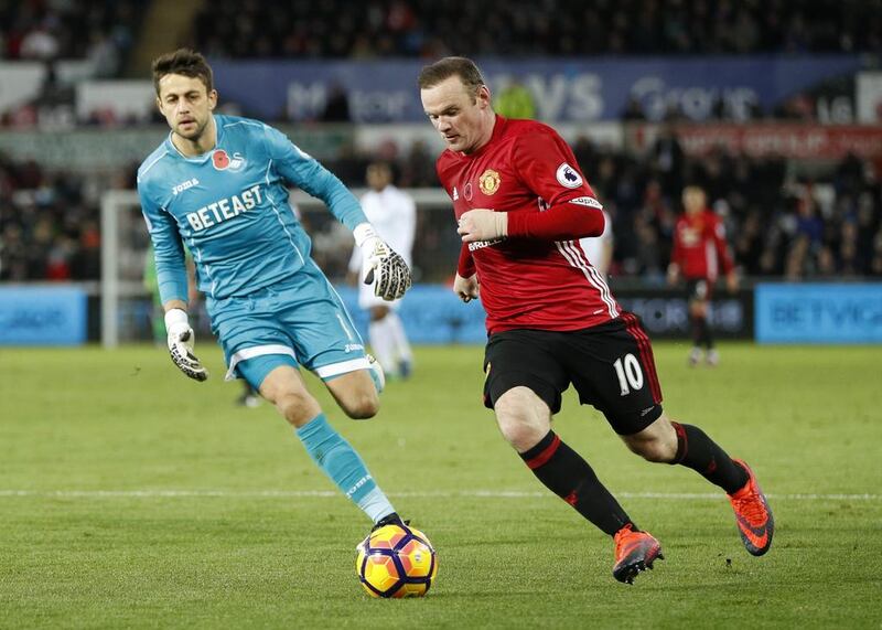 Manchester United’s Wayne Rooney in action with Swansea City’s Lukasz Fabianski. John Sibley / Action Images / Reuters