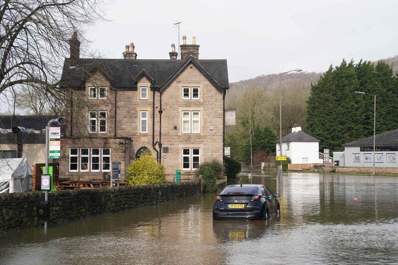 A stranded vehicle in flood water in Belper, Derbyshire, as the British public has been warned to brace for strengthening winds and lashing rain this week. PA Images