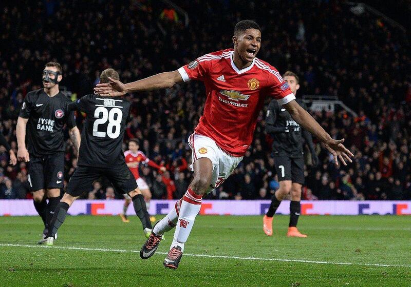 Manchester United's English striker Marcus Rashford celebrates scoring his team's third goal during the UEFA Europa League round of 32, second leg football match between Manchester United and and FC Midtjylland at Old Trafford in Manchester, north west England, on February 25, 2016. / AFP / OLI SCARFF