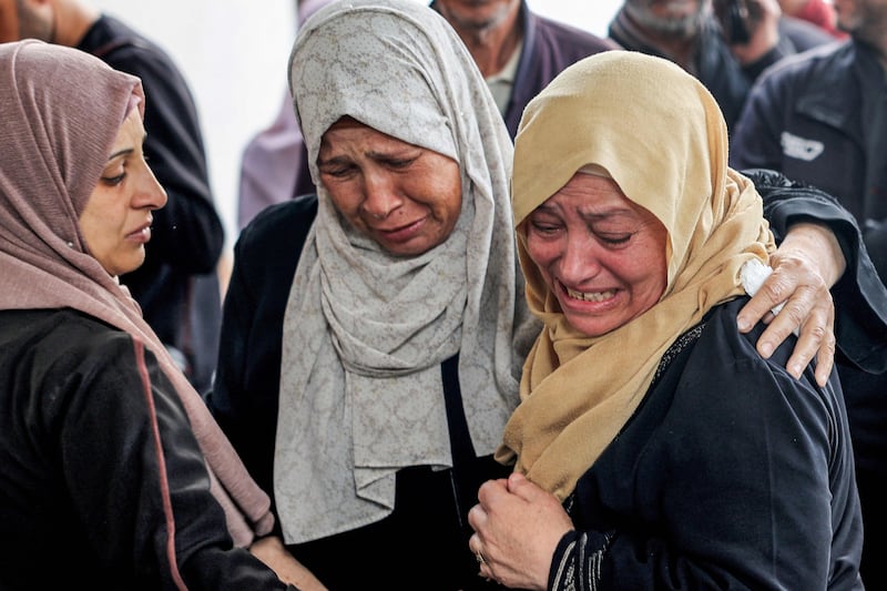 Women mourn loved ones killed overnight in the Israeli bombing of Al Najjar Hospital in Rafah, southern Gaza. AFP