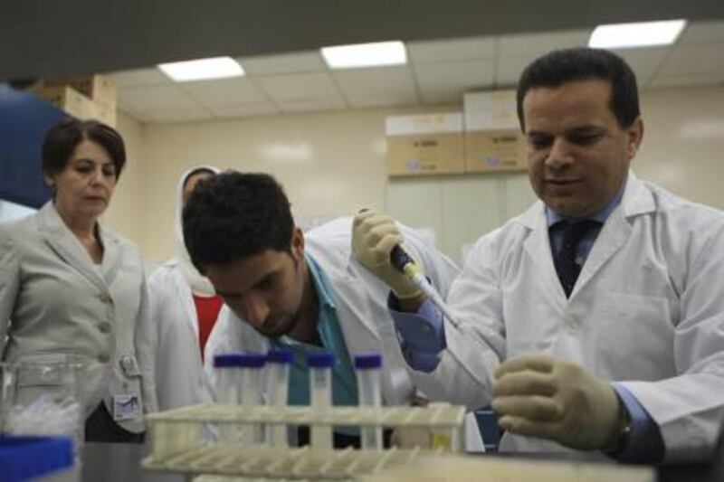 AL AIN - 03MAR2011 - Dr. Bassam Ali (right) Associate professor and Professor Lihadh al Gazali (left) showing gene defects and mutations related to inherited conditions  to research students at the faculty of Medicine and health Sciences department UAE University in Al Ain. Ravindranath K / The National