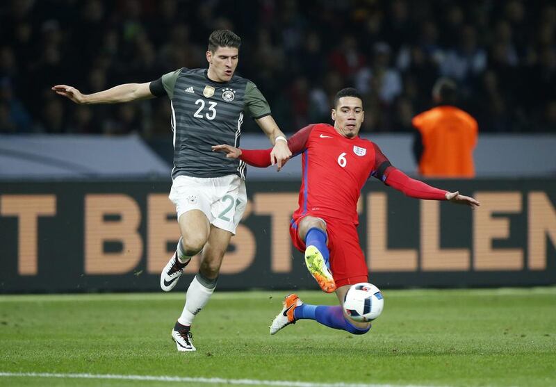 Germany’s Mario Gomez in action with England’s Chris Smalling. Reuters / Fabrizio Bensch