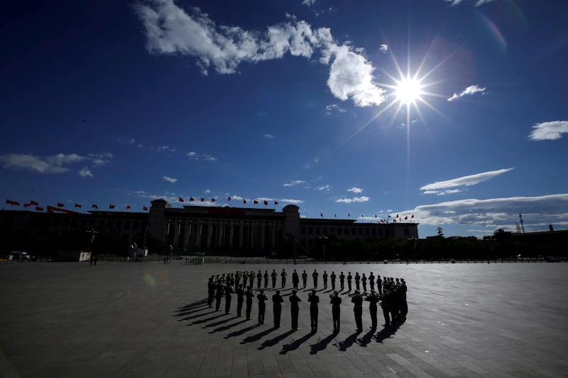 A military band practises at Tiananmen Square for a tribute ceremony in front of the Monument to the People's Heroes, ahead of National Day marking the 69th anniversary of the founding of the People's Republic of China in Beijing, China. Reuters