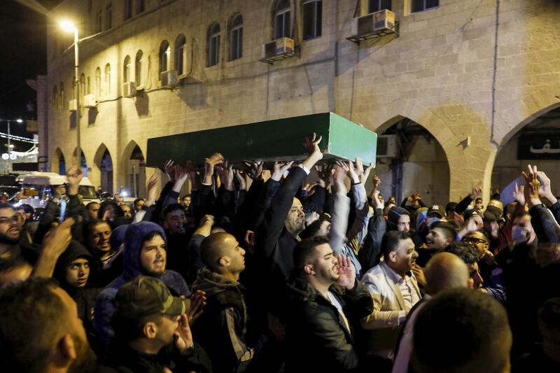 Palestinians carry the coffin of Iyad Hallak, a disabled Palestinian man who was shot dead by Israeli police after they mistakenly thought he was armed with a pistol, during his funeral in Jerusalem.  AFP