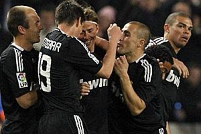 Real Madrid players celebrate a goal against Espanyol as the club go on to record their tenth win in a row.