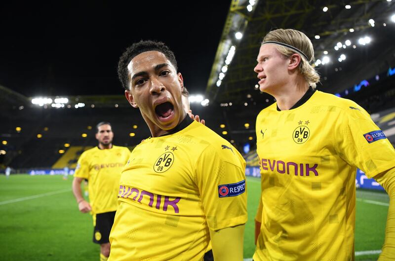 Borussia Dortmund's Jude Bellingham celebrates scoring their first goal with Erling Braut Haaland. Reuters