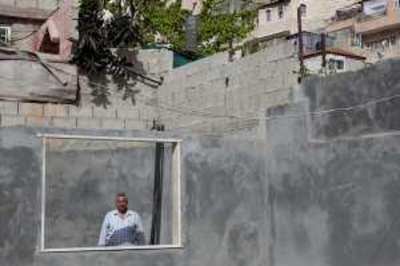 Jerusalem, Israel - March 23, 2010:  Fakhri Abu Diab, 48, Chairman of the Silwan Committee poses for a portrait in his kitchen being built in his house which is supposed to be demolished by May 20, 2010.  ( Photo by Philip Cheung ) 